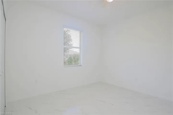 Unfurnished room with ceiling fan