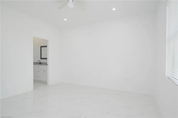 Spare room with ceiling fan