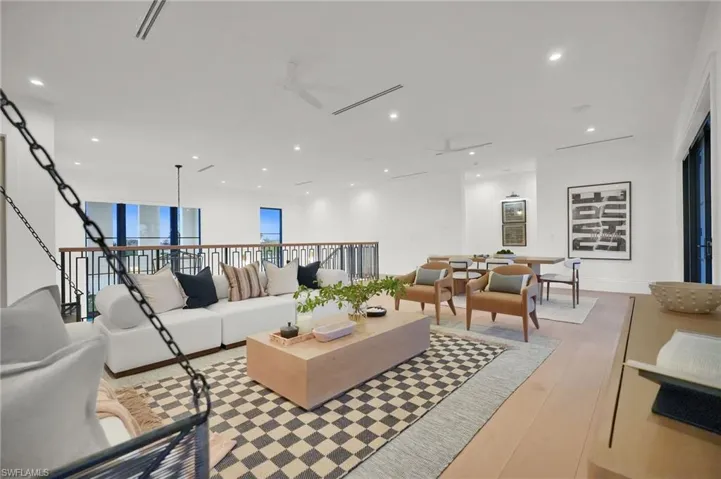 Living room featuring recessed lighting, light wood-style floors, and ceiling fan