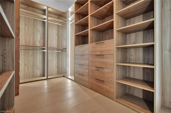 Walk in closet featuring light wood-type flooring