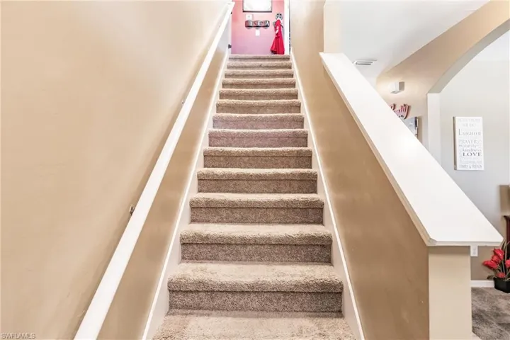Stairway featuring carpet