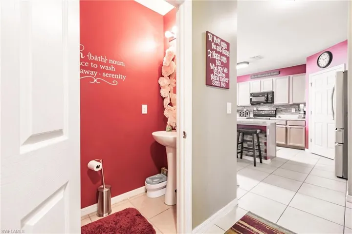 Bathroom with tile flooring and backsplash