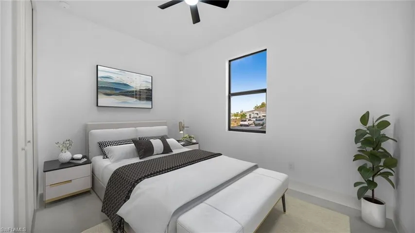 Bedroom featuring concrete flooring and a ceiling fan