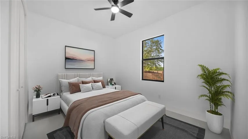 Bedroom featuring concrete floors and ceiling fan