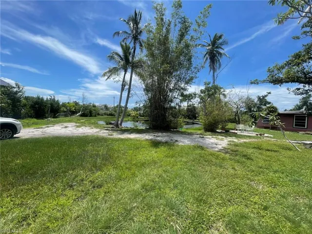 View of yard with a water view