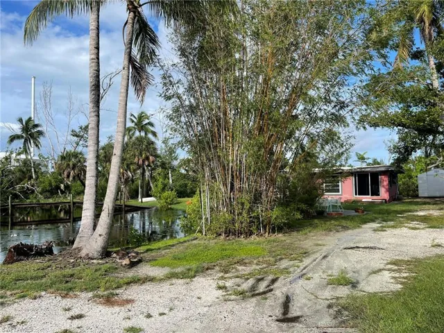 View of yard with a water view