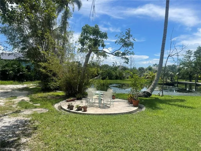 View of yard featuring a patio and a water view