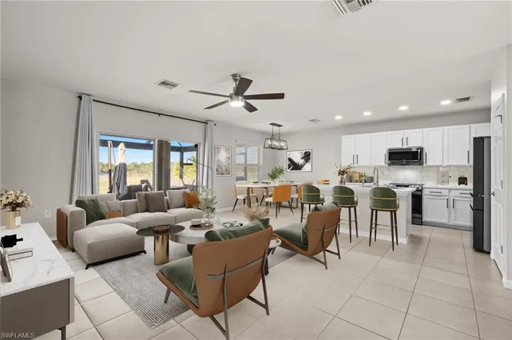 Tiled living room featuring ceiling fan