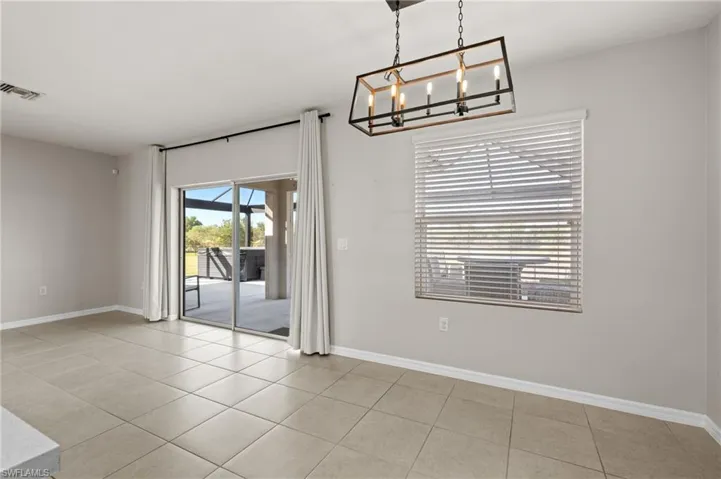 Unfurnished dining area with light tile patterned floors