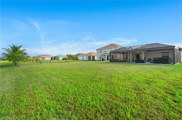 View of yard featuring glass enclosure