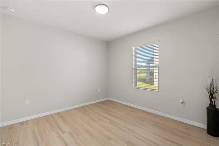 Empty room with light wood-type flooring