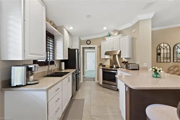 Lots of counter space in this kitchen for entertaining, food display and seating.