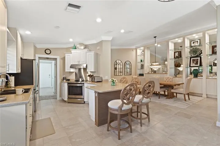 Kitchen and formal dining room are in close proximity to spread out when entertaining.