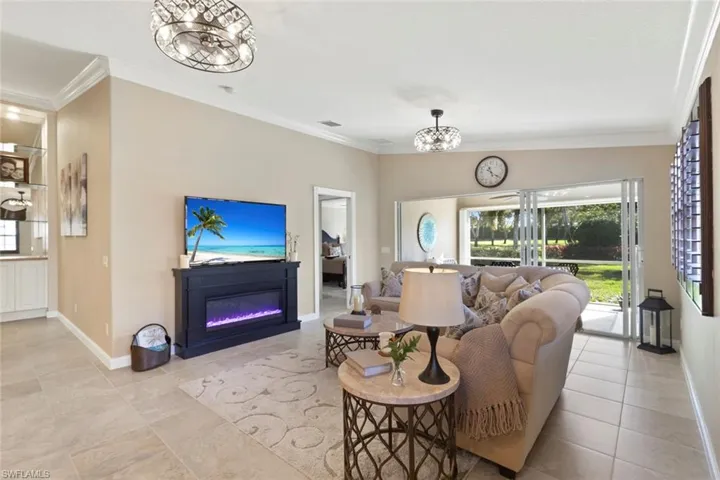 Spacious family room with slider to Lanai. Crystal lighting is also a fan.