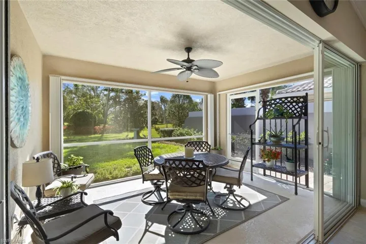 Sunny Lanai with storm shutters and door to back yard.