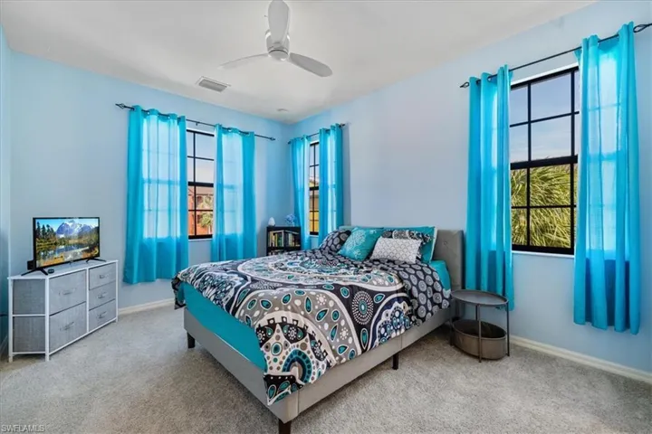 Bedroom with carpet and ceiling fan