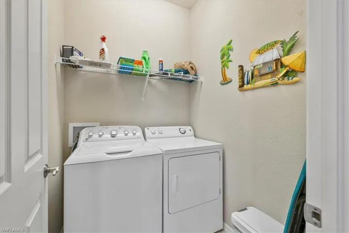 Laundry room featuring washing machine and clothes dryer