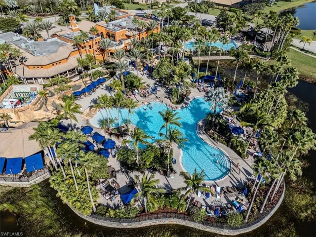 Birds eye view of property with a water view