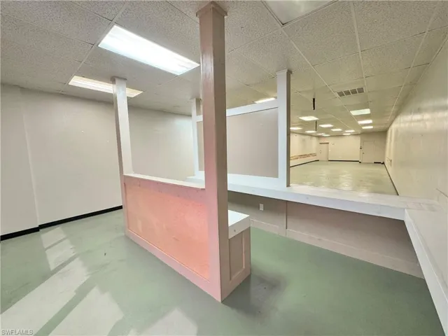 Basement with a paneled ceiling