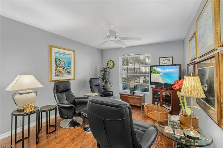Office area featuring ceiling fan, baseboards, and wood finished floors