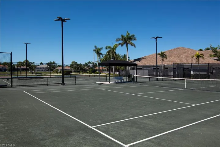 View of tennis court with fence
