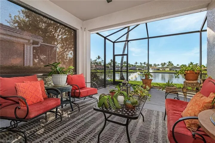 Sunroom / solarium with a water view