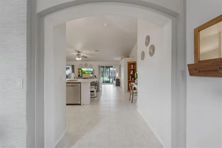 Hallway with light tile patterned floors