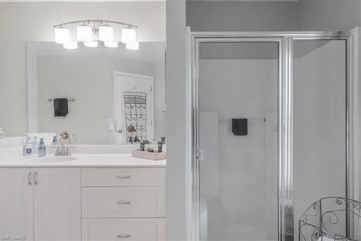 Bathroom with vanity and an enclosed shower