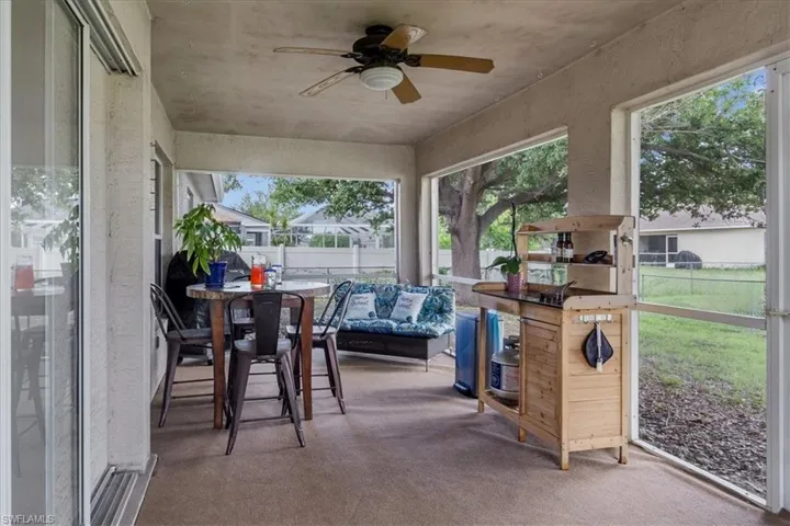 Sunroom featuring ceiling fan