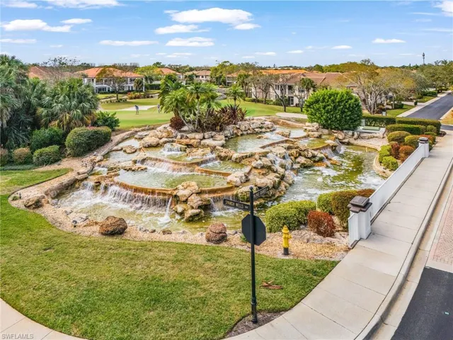 View of home's community featuring a water feature
