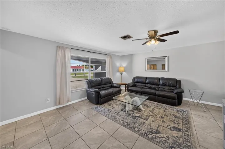 Neutral-toned tile flooring throughout