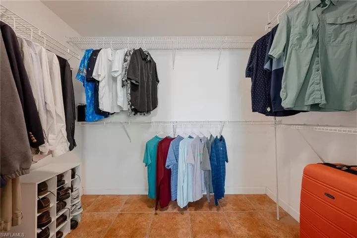 Walk in closet with tile floors