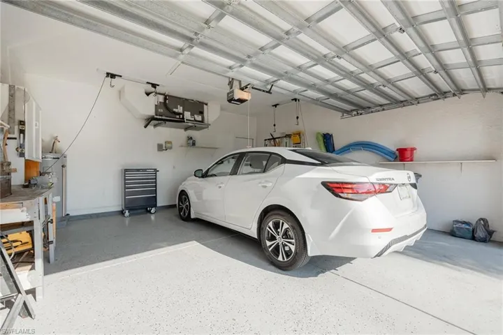 Garage featuring a garage door opener