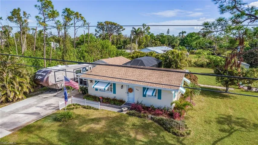The back of the home is private, with palms and shrubs on three sides.  The seller has a garden area in the rear of the property.