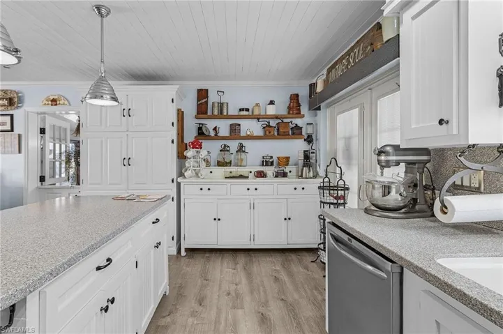 "Buffett" on the wall in the background doubles as additional storage and a coffee bar.