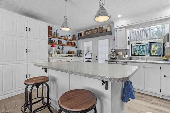 Remodeled kitchen with corian counters.