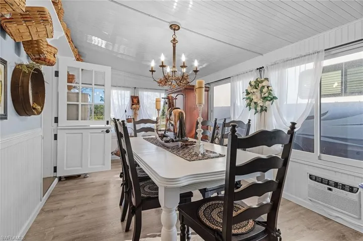The sunroom has an air conditioner and is used as a dining room.