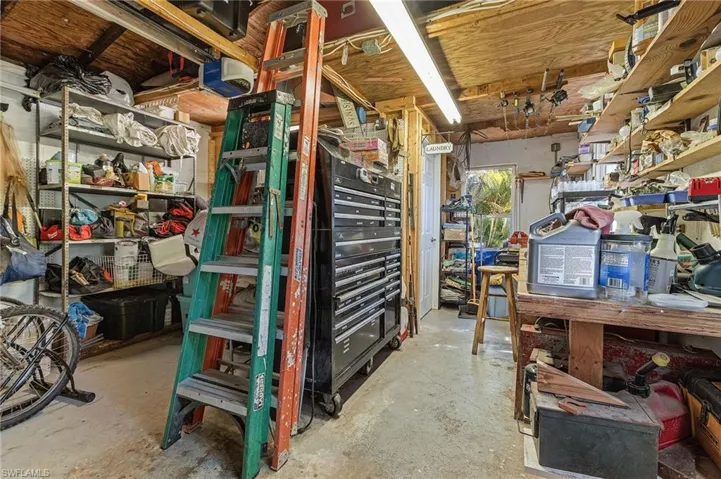 The garage has lots of storage, including a separate laundry in the back.
