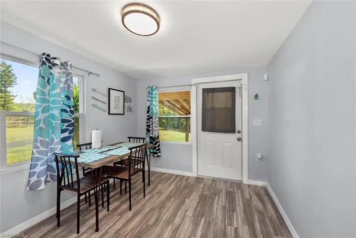 Dining room featuring baseboards and wood finished floors