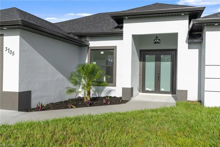 Doorway to property featuring french doors