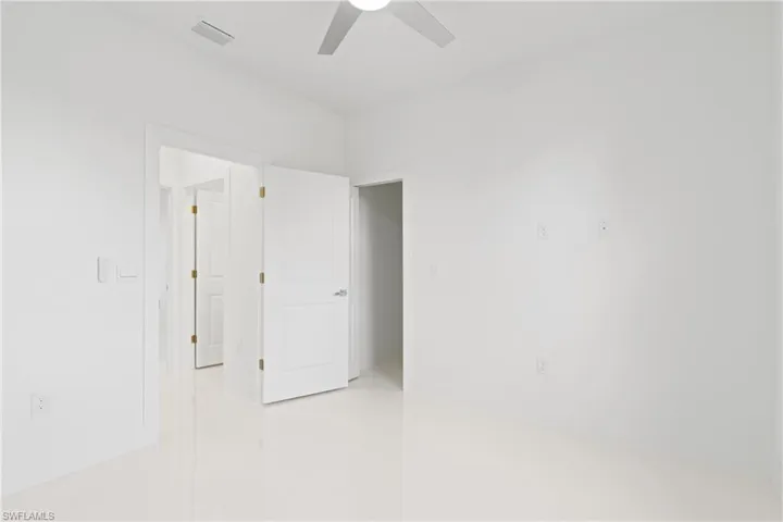Unfurnished room featuring ceiling fan
