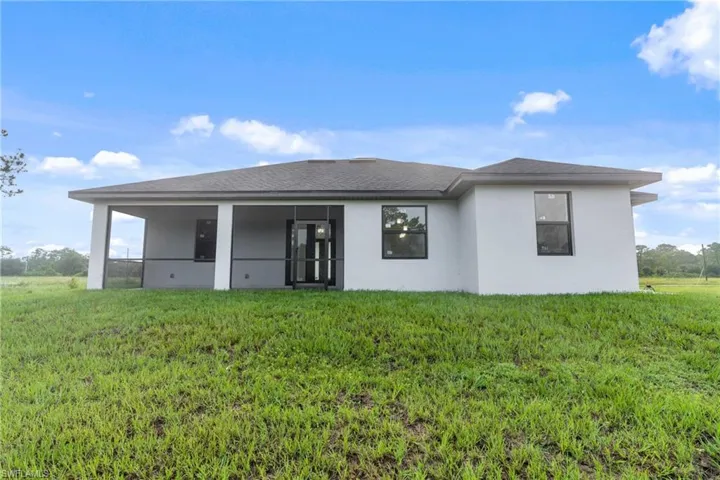 View of front of property with a front yard