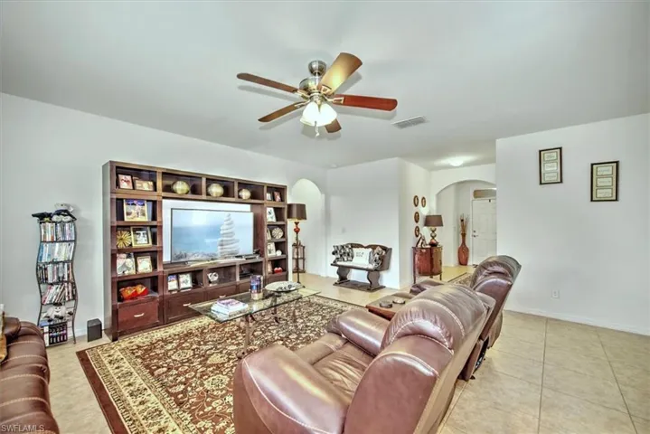 Tiled living room with ceiling fan