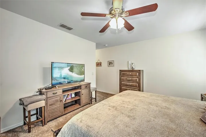 Bedroom featuring carpet floors and ceiling fan