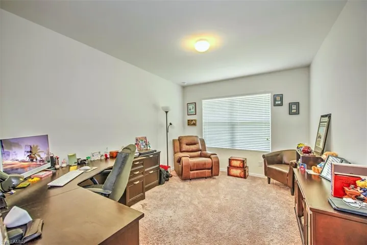 Office space featuring light colored carpet