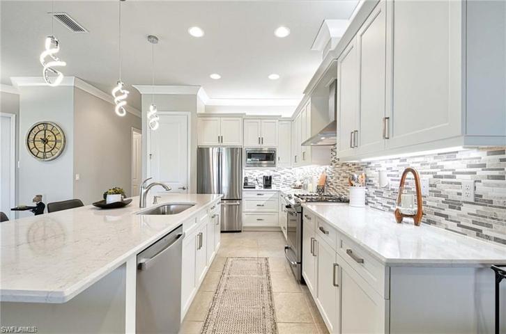 Quartz countertops, upgrade appliances, amazing lighting, and center island.