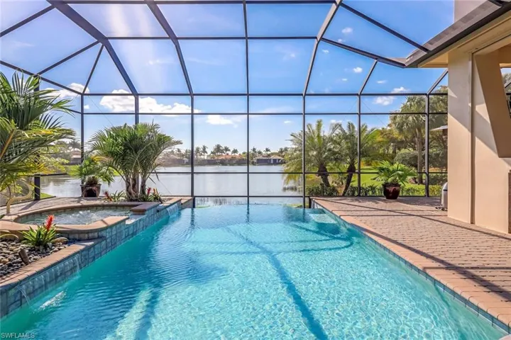 Love the way the pool is positioned to give this outdoor space such a modern look with your gorgeous long lake view.