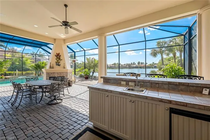 This entire covered lanai  area has electric Kevlar storm protection shades. Great for summer storage.