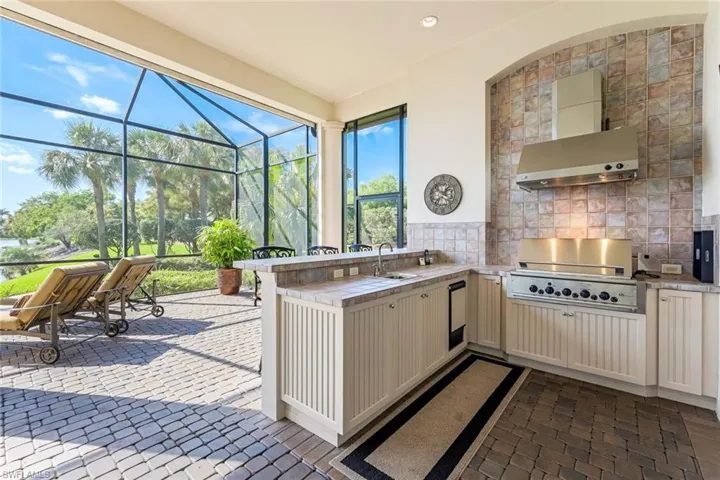 Summer Kitchen with TV for plenty of sunset entertaining.