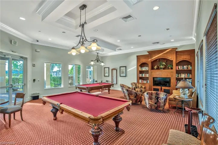 Playroom with carpet flooring, pool table, and crown molding
